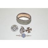 A white metal bangle; silver brooches; etc.
