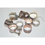 A quantity of metal, white metal and silver napkin rings, various.