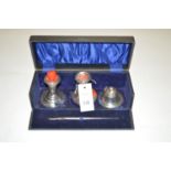 A silver writing set, Chester 1912, to include: inkwell, quill and two sealing wax candlesticks,