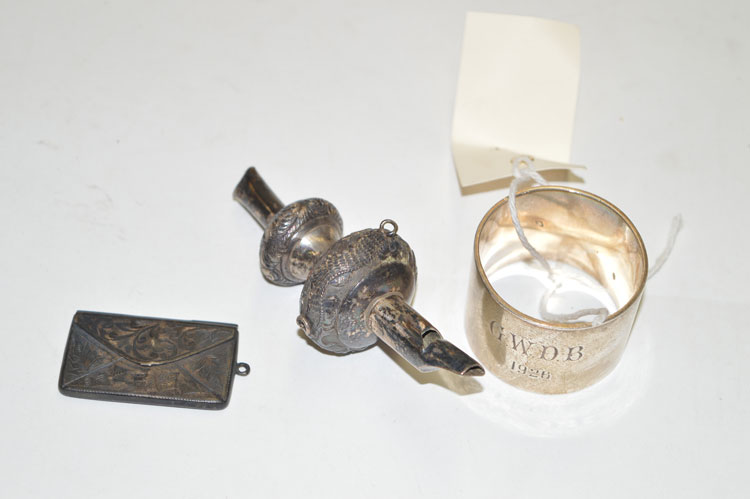 A 19th Century rattle (missing bells and teether); a silver envelope pattern stamp case;
