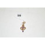 An Edwardian 9ct yellow gold drop pendant, of Art Nouveau design, by Henry Matthews,