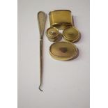 Silver gilt dressing table bottle covers and base; together with a button hook.