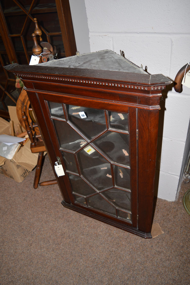 An early 20th Century mahogany hanging corner cabinet,