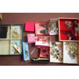 A large quantity of costume jewellery, in jewellery boxes, some by Butler & Wilson.