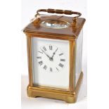 A late 19th Century lacquered brass cased carriage clock,