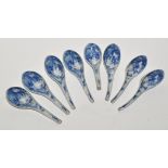 Eight blue and white ladles, the bowls with figures within landscapes, length 15.5cm approx.
