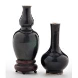Black glaze bottle shape cabinet vase, with slightly spreading neck, height 7.