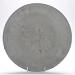 Large celadon dish, the flattened rim above plain cavetto enclosing central panel,