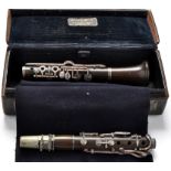 A Boosey & Hawkes E-flat clarinet with white metal fittings, stamped 'M.P.C.B.