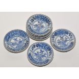 Eight blue and white saucer dishes,