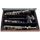 A Belgium early 20th Century Black-wood clarinet by Jaque Albert, Brussels, with metal fittings,