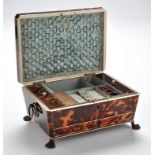 A 19th Century tortoiseshell work box, decorated throughout with ivory stringing,