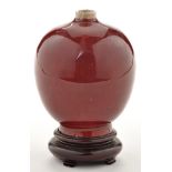 Small flambé glaze ovoid shaped vase, with flattened shoulders rising to narrow white glaze neck,