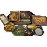 A collection of trays, to include: a mahogany brass bound tray of oval form and scrolling handles,