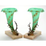 *A pair of late 19th Century glass and giltmetal vases,