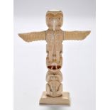 A late 19th/early 20th Century native American North West Coast walrus ivory totem,