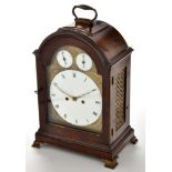 A George III style mahogany cased mantel clock, circular roman enamelled dial,