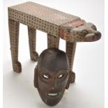 An African painted wooden stool, 34cms (13 1/2in.) high; together with a tribal mask 26cms (10in.