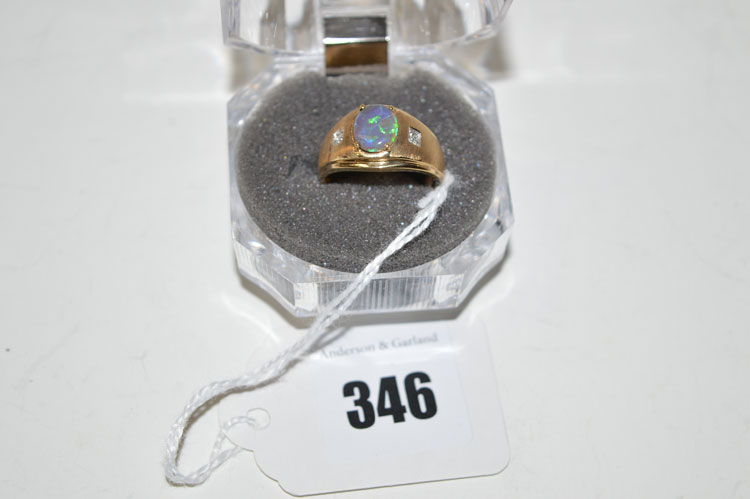 A synthetic opal and small diamond ring, on yellow metal shank stamped '14k., P'.