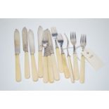 A set of six fish knives and six fish forks with silver blades and prongs, fitted ivory handles,
