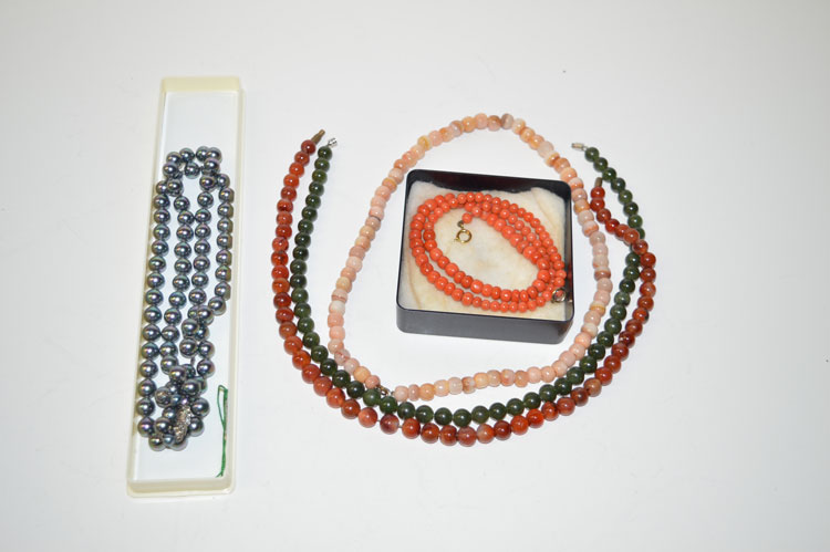 A quantity of hardstone and cultured pearl necklaces.