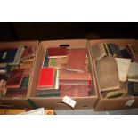 *A collection of antique and modern books, some leather bound,