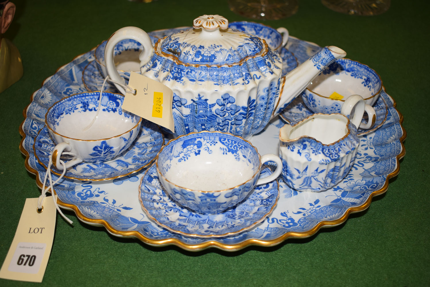 A blue and white Copeland tea set on fluted tray, comprising: five cups and saucers, tea pot,