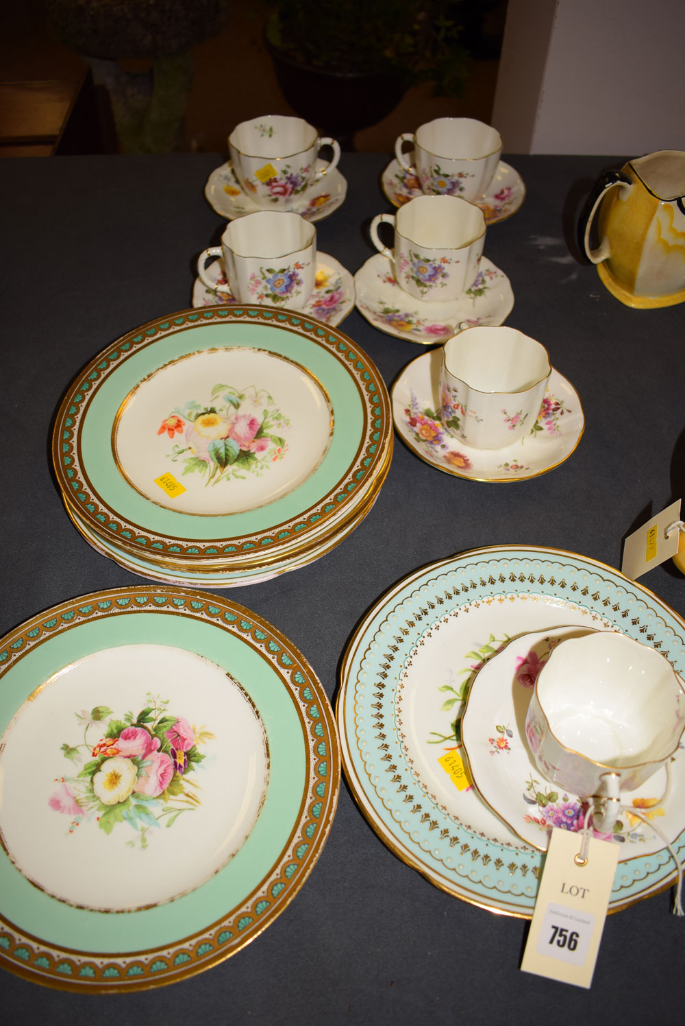 A set of four Royal Crown Derby teacups and saucers;