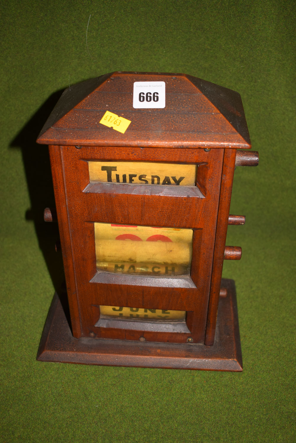 An Edwardian stained wood desk top perpetual calendar.