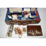 A large quantity of costume jewellery in a brown leather attaché case.