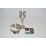 A silver vase; a silver sugar basket with pierced design and foot; and two silver napkin rings,