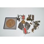 An Indo Persian metal belt buckle; a constabulary medal; various watch chains; fobs; and sundries.