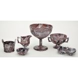 Six pieces of milky purple marbled glass of 'North East' interest,