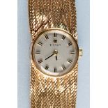 Tissot: a 9ct. gold lady's wristwatch, with circular silvered baton dial and textured strap, 27.6oz.