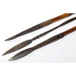 Two 1868 pattern steel lance heads, on bamboo shafts with lead waited ends,