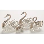 A pair of Continental silver and cut glass table salts,