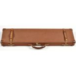 Brady of Halesowen: a canvas covered leather trimmed car case for a 12 bore shotgun,