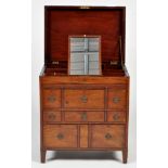 A George III mahogany campaign washstand, the hinged top opening to reveal a fitted interior,