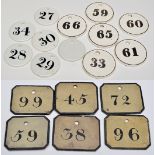 Various earthenware and slate circular and rectangular number plaques, with numerals in black.