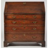 A George III oak bureau, with a rectangular hinged fall-flap opening to reveal a fitted interior,