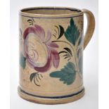 Painted pearlware tankard of possible 'North East' interest, with floral bloom and foliate meander,