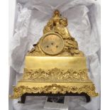 A French late 19th Century gilt bronze mantel clock, with circular roman dial,