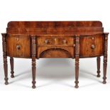 A William IV mahogany sideboard, the raised step back above bowfront top,