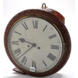 A 19th Century carved wall clock, with circular painted roman dial, two train fusee movement,