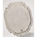 An Elizabeth II salver, by Viners, Sheffield 1957, of canted square form, on leaf cast knurl feet,