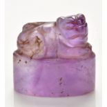 Amethyst 'beast' seal, the recumbent creature with its head turned to the right, height 2.1cm.