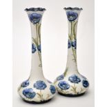 Near pair of Moorcroft 'Cornflower' pattern bottle vases,