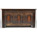 An 18th Century oak coffer, with carved arched panels to front, 46 x 19 x 24 1/2in. high.