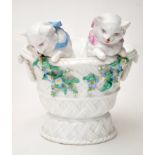 Bone china basket, with two cats leaning out from the bowl, enamelled ribbons and posy pendants,