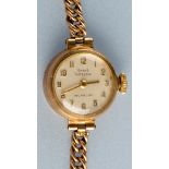 Girard Perregaux: Incabloc: a lady's 9ct. gold wristwatch, with circular arabic dial, 9ct.